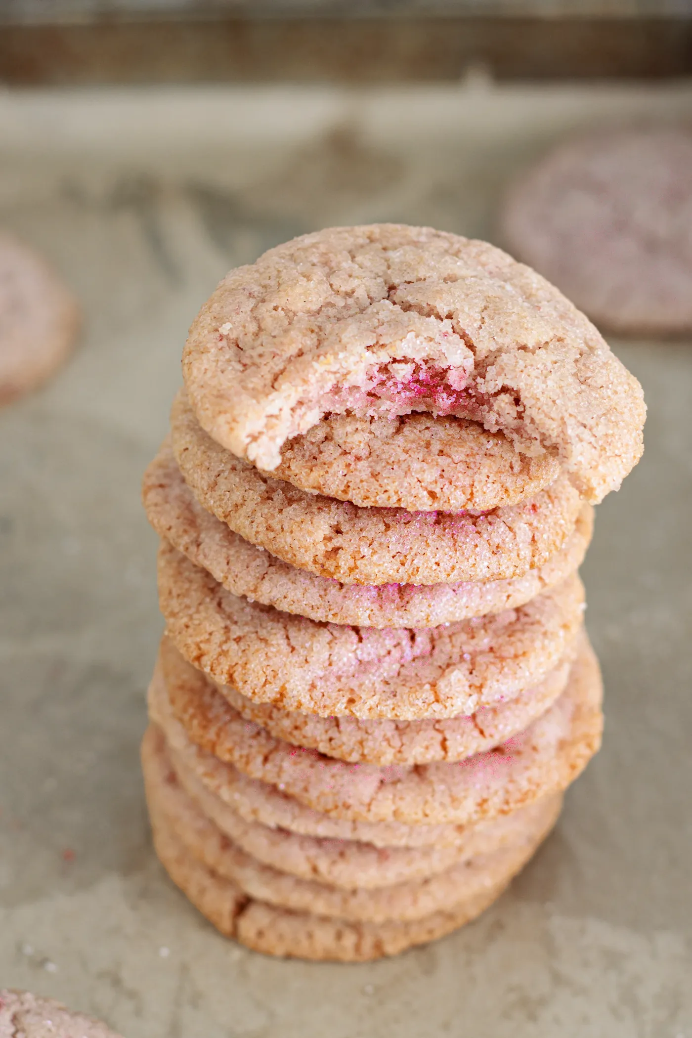 Stack of pink strawberry sugar cookies with crackled sugar-coated tops